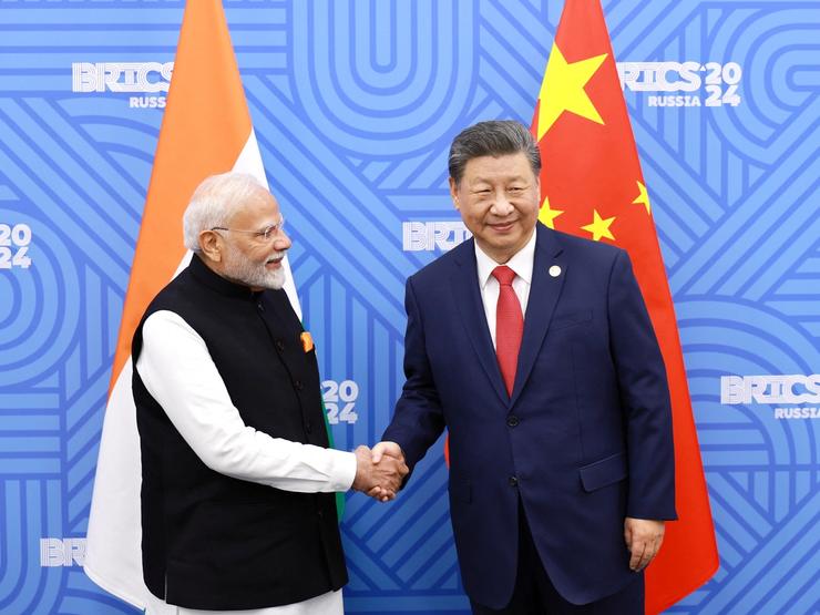 Xi Jinping and Narendra Modi shake hands at the 2024 BRICS summit