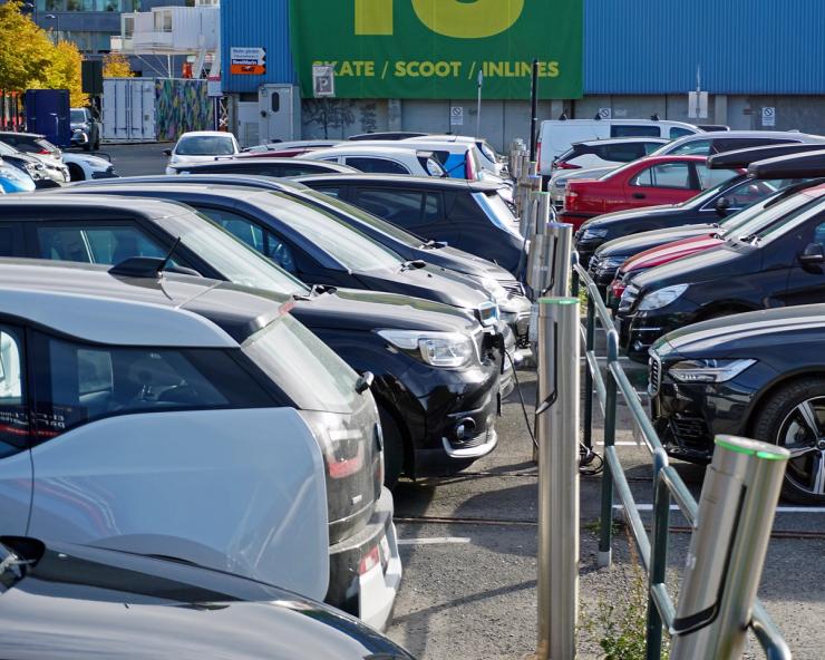 Electric vehicles charge in a parking lot in Oslo, Norway.