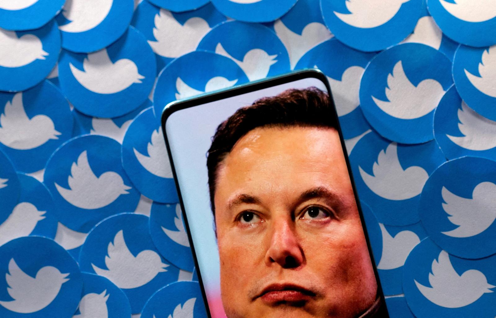 Elon Musk and Twitter's logo