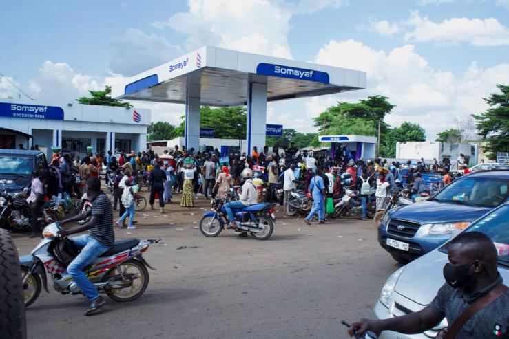 People gather at a petrol station due to shortage of petrol in Bamako, Mali.