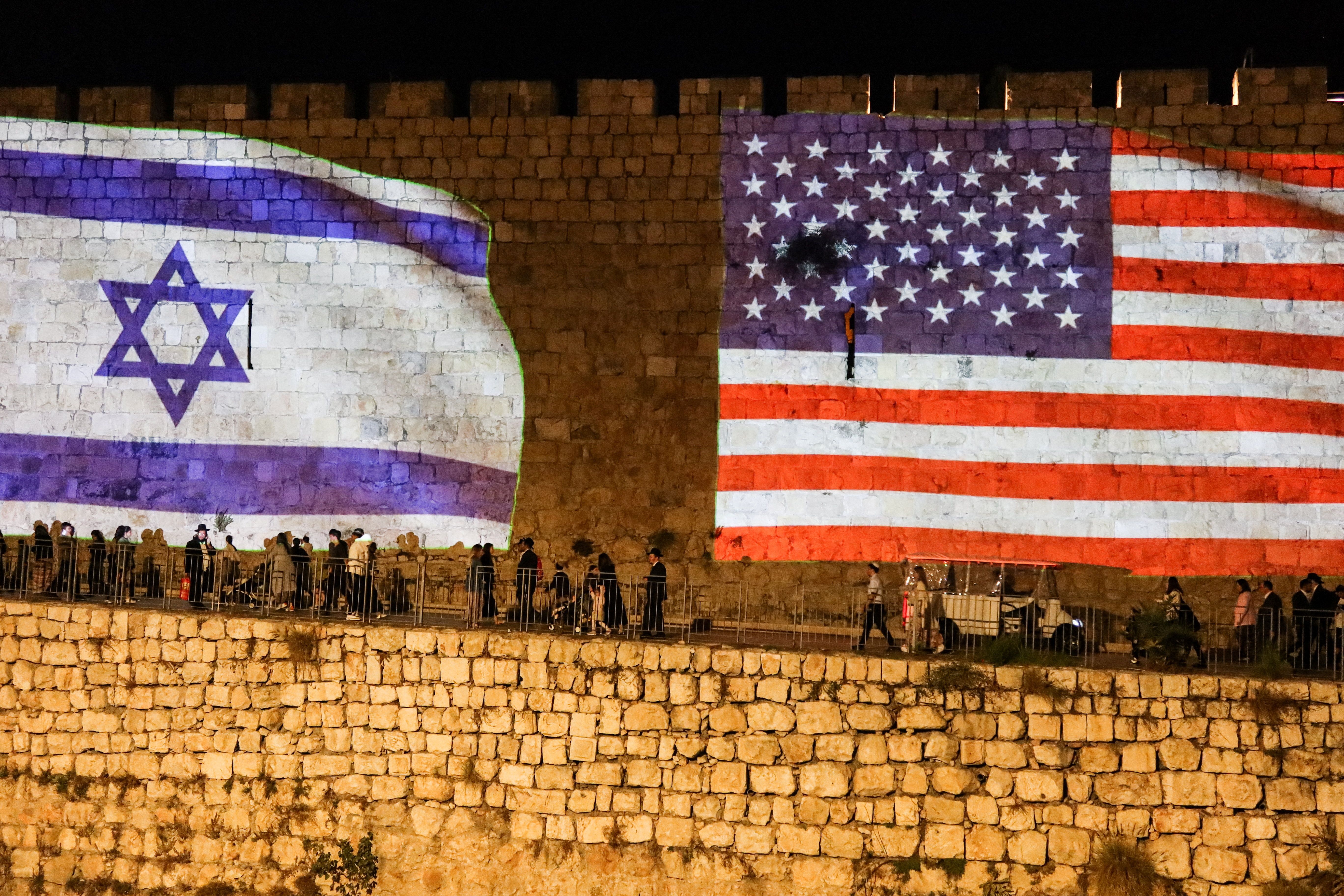 United States and Israel flags are projected on the walls of the Old city of Jerusalem