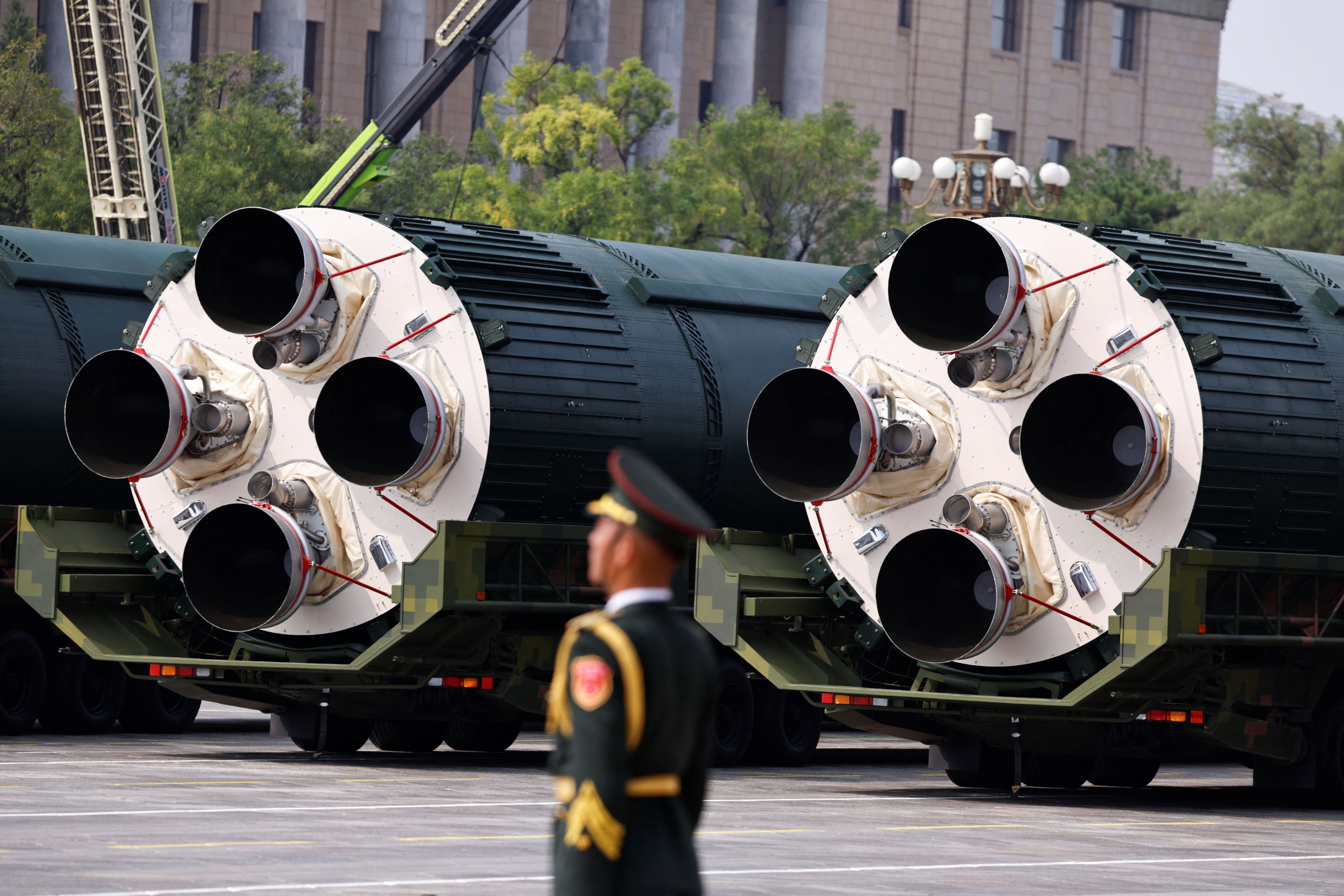 A member of the People’s Liberation Army stands as the strategic strike group displays DF-5C nuclear missiles during a military parade to mark the 80th anniversary of the end of World War Two, in Beijing
