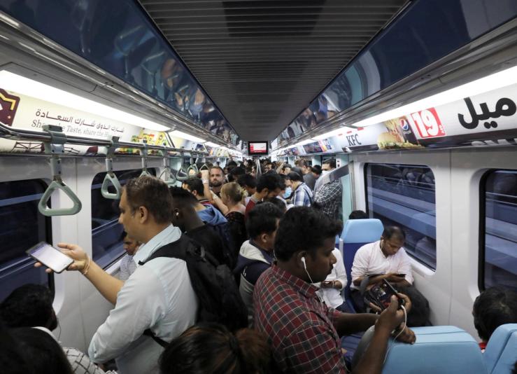 Commuters ride the metro in Dubai.