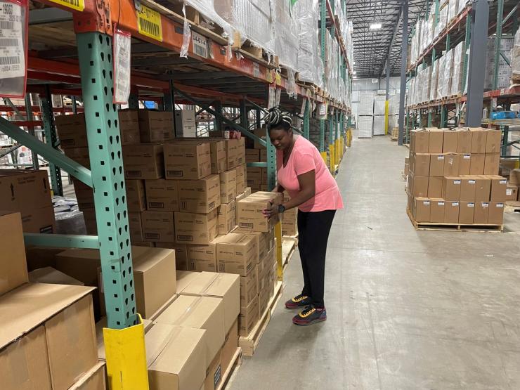 Sheila Ikenye picks boxes for a shipment at Kem Krest’s warehouse in Elkhart, Indiana, U.S