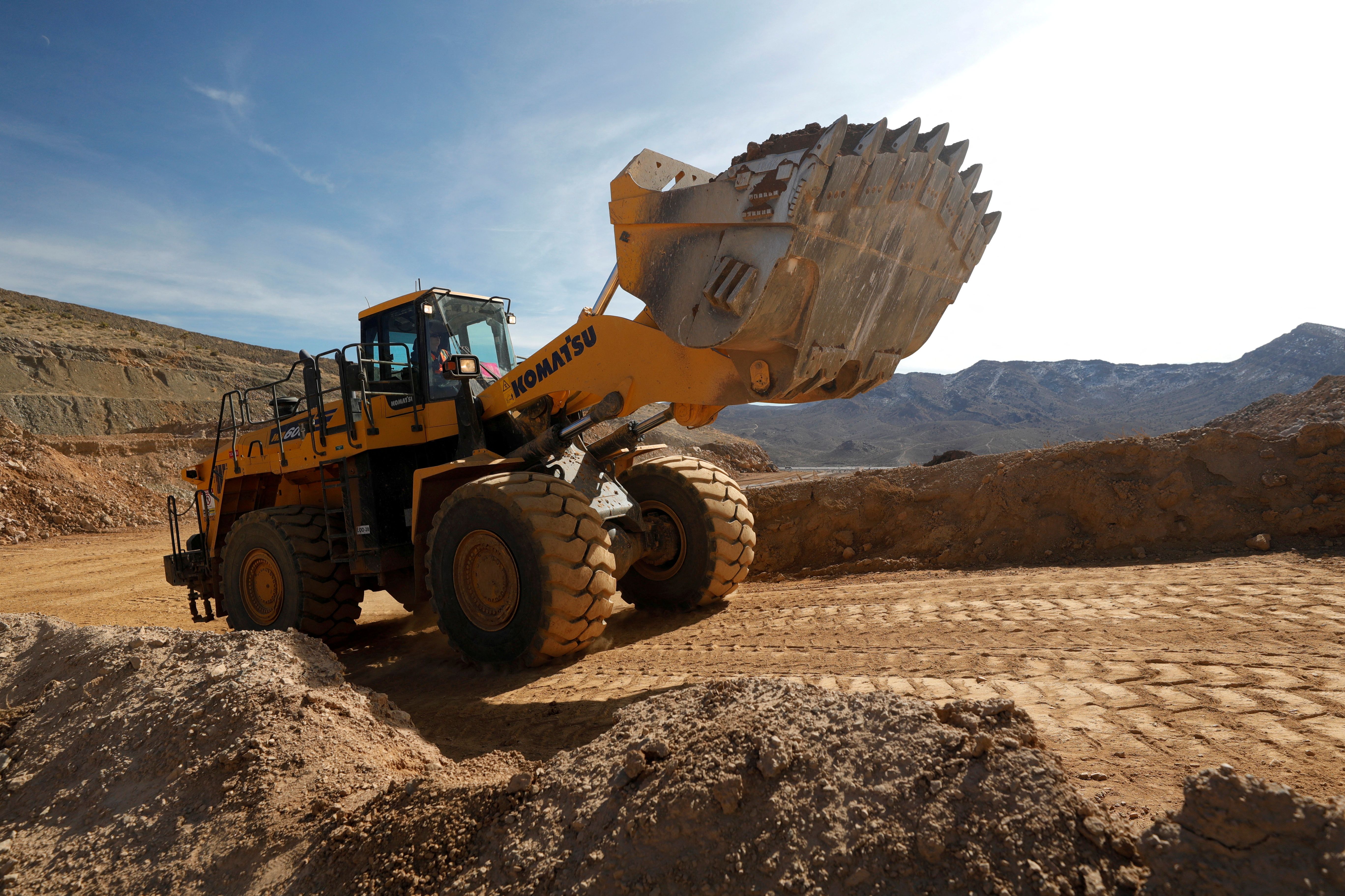 A wheel loader takes ore to a crusher at the MP Materials rare earth mine in Mountain Pass.