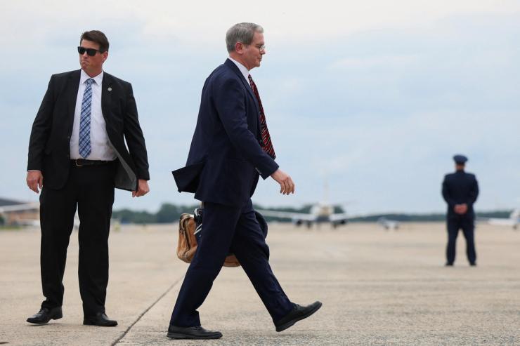 U.S. Treasury Secretary Scott Bessent walks to board Air Force One.