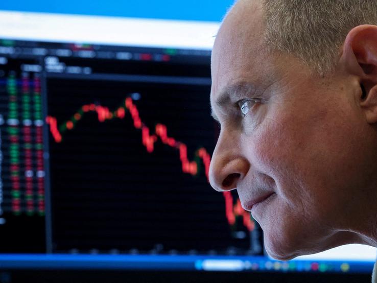 A futures-options trader works on the floor at the New York Stock Exchange’s NYSE American (AMEX) in New York City,