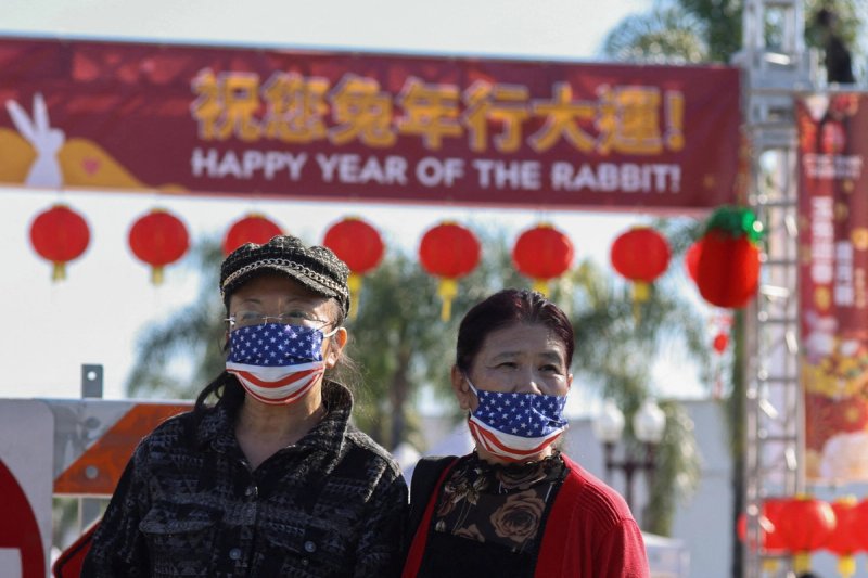People look on from a street near the location of a shooting that took place during a Chinese Lunar New Year celebration, in Monterey Park, California, U.S. January 22, 2023.