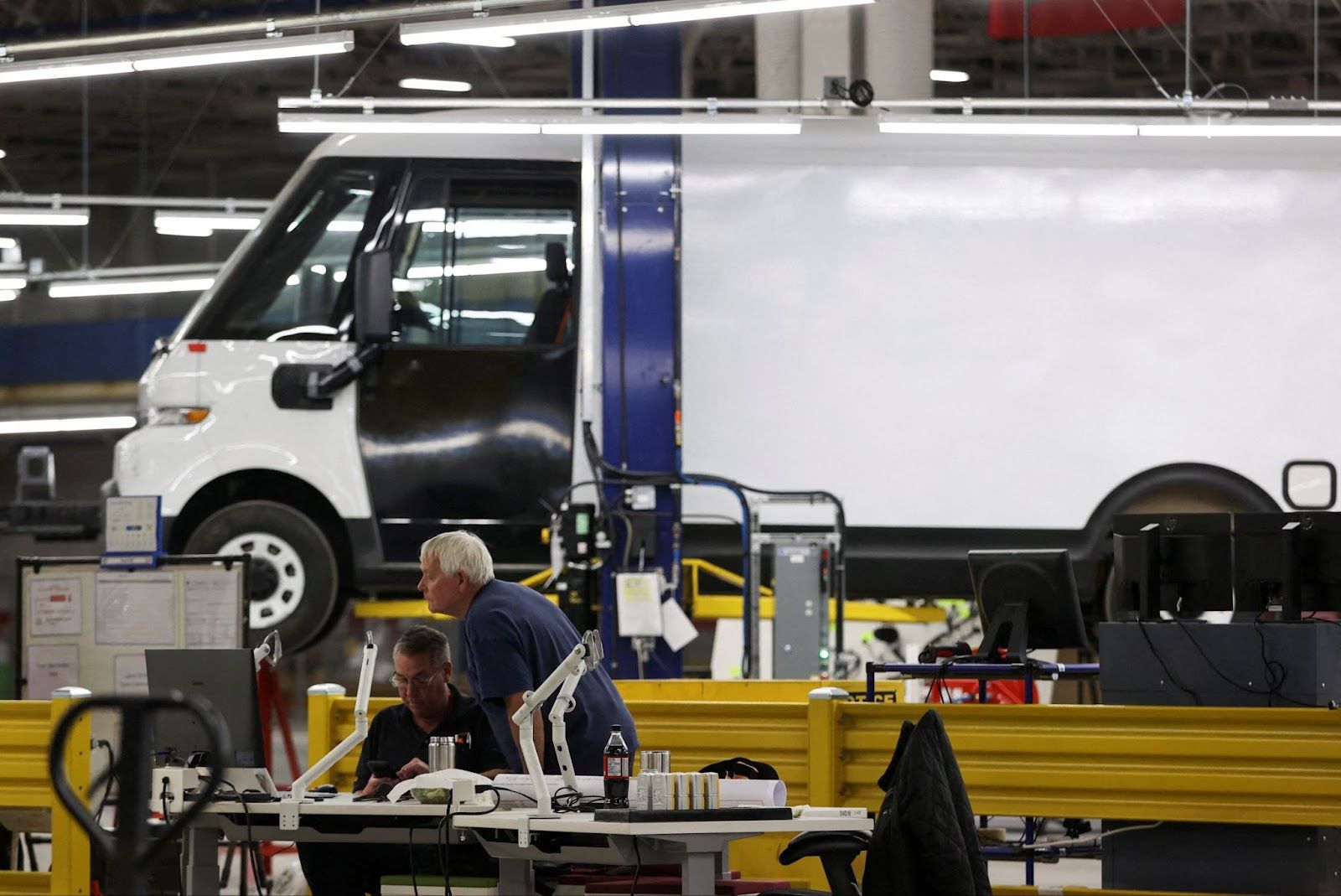 Employees work on the line at automaker General Motors (GM) Brightdrop unit’s CAMI EV Assembly, Canada’s first full-scale electric vehicle manufacturing plant, in Ingersoll, Ontario.