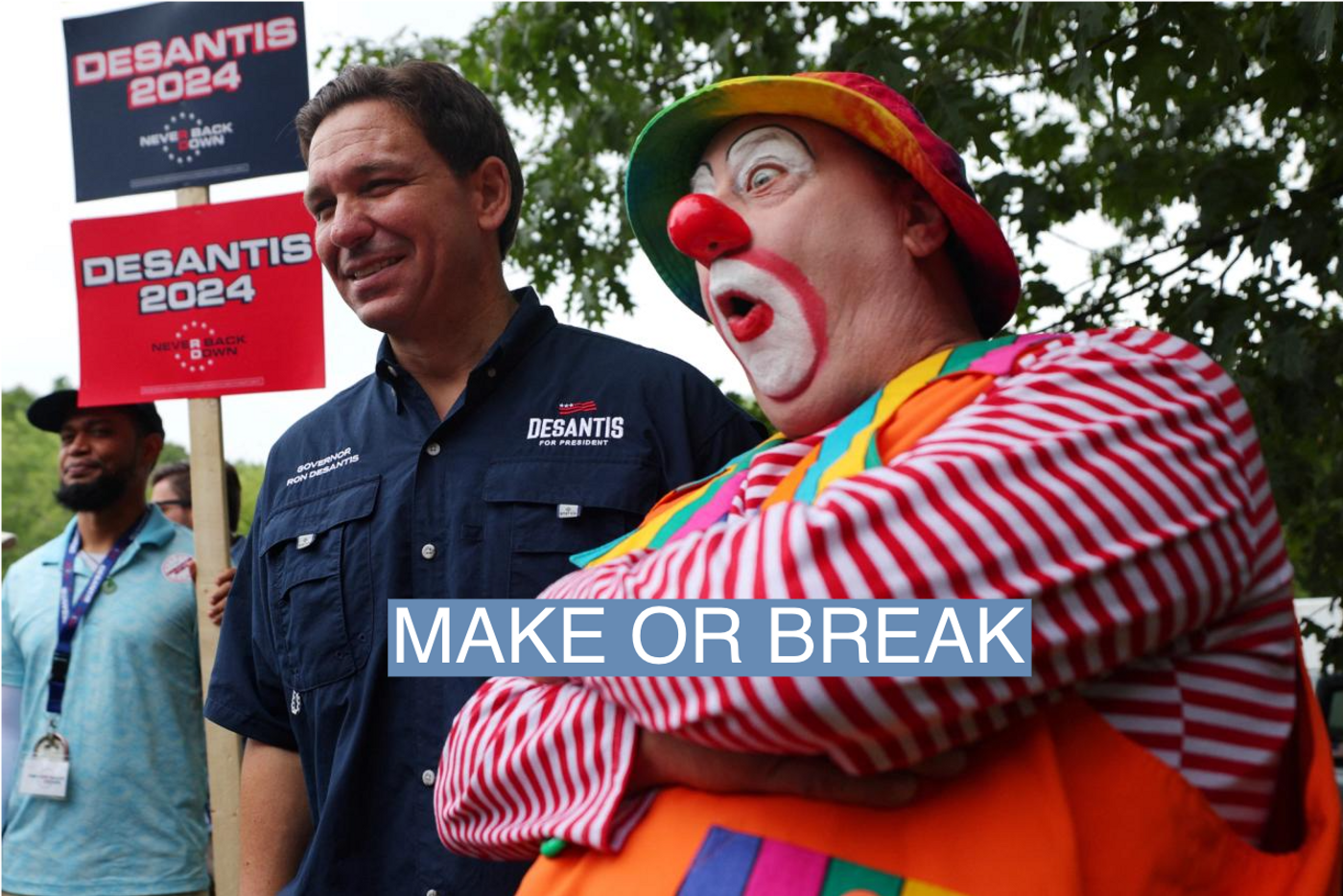 Republican presidential candidate and Florida Governor Ron DeSantis poses for a photograph with a Shriner’s clown at the Old Town Day Parade in Londonderry, New Hampshire, U.S., August 19, 2023.
