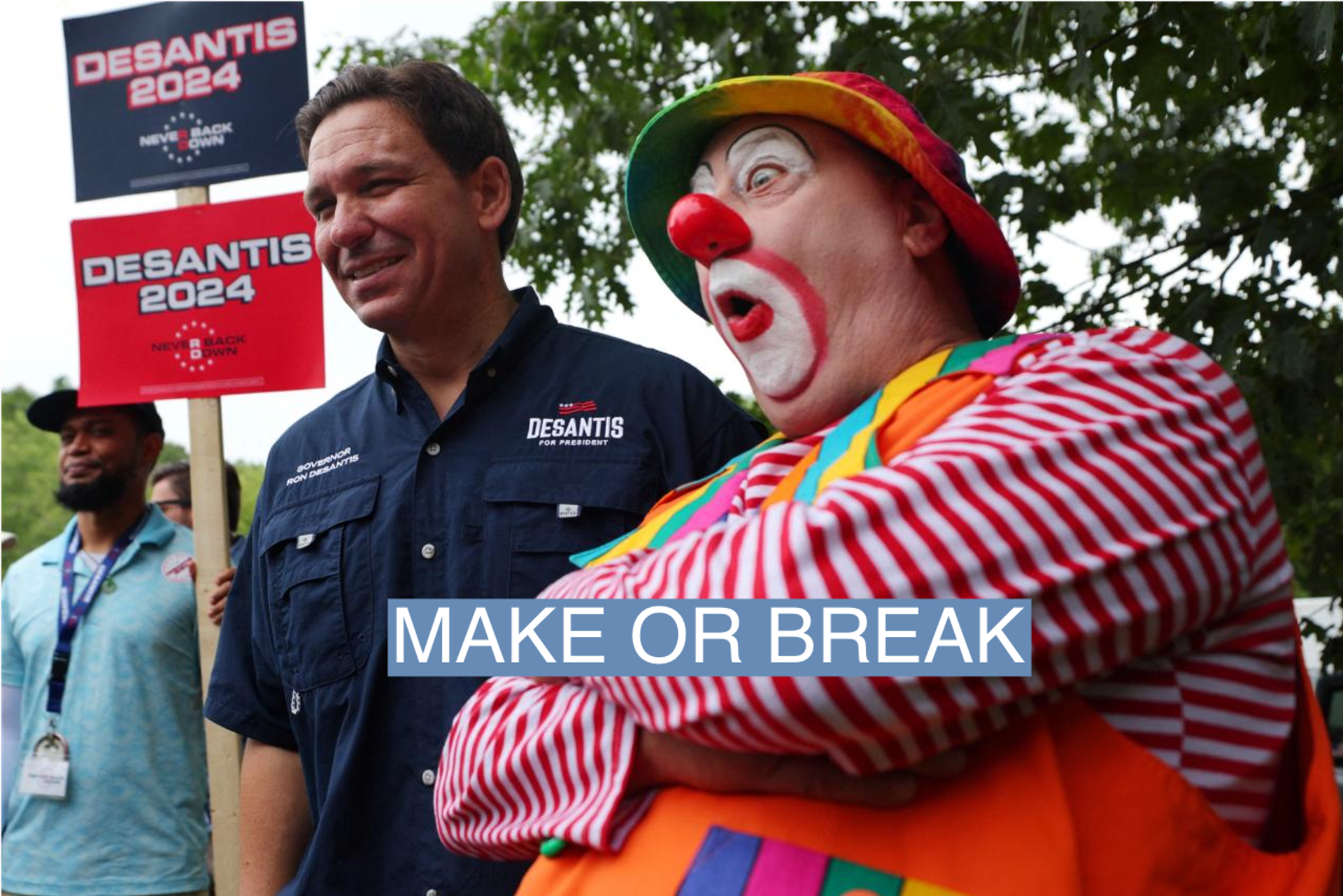 Republican presidential candidate and Florida Governor Ron DeSantis poses for a photograph with a Shriner’s clown at the Old Town Day Parade in Londonderry, New Hampshire, U.S., August 19, 2023.