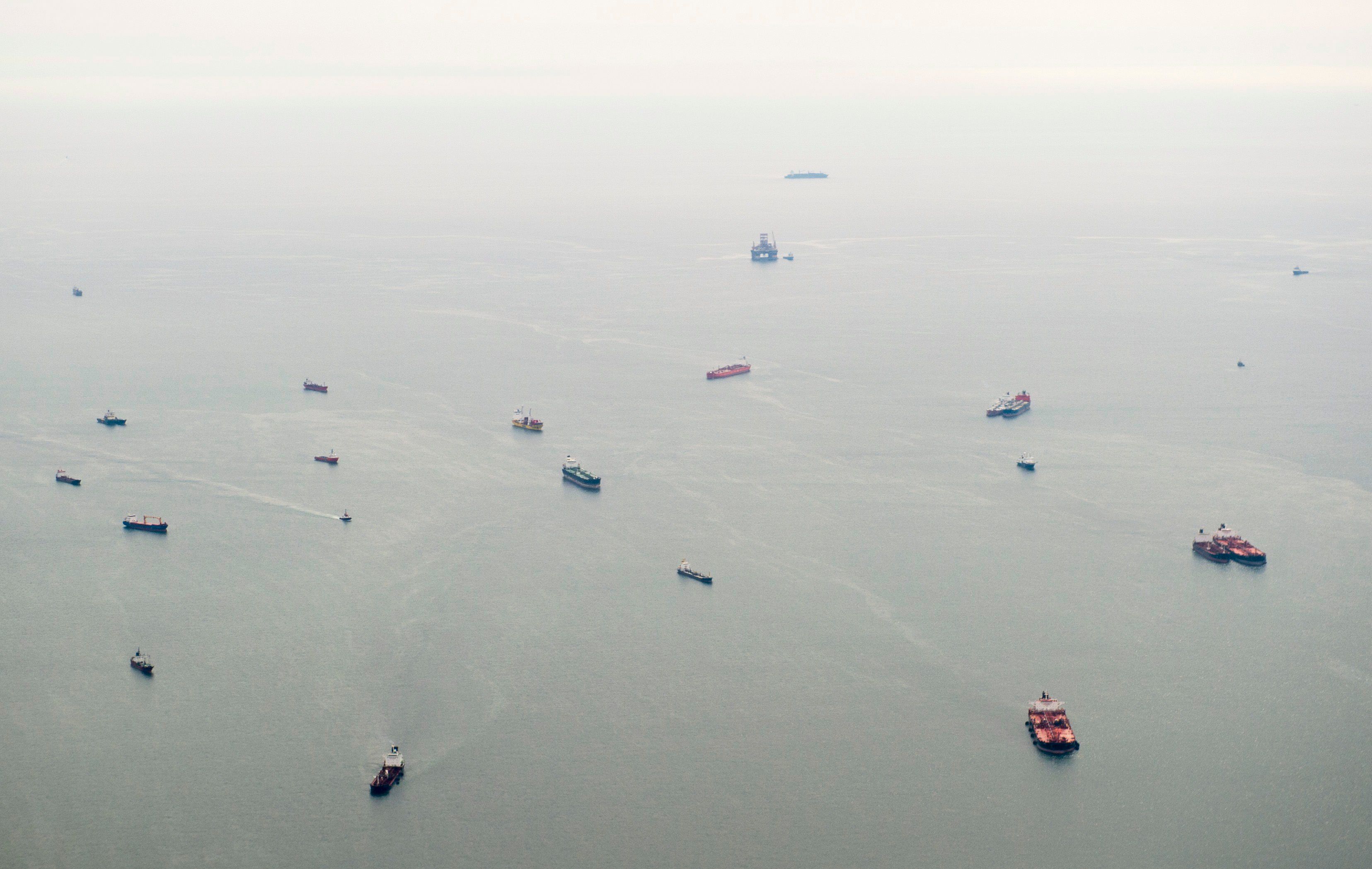 An aerial view of ships waiting to dock at a port in the Atlantic Ocean off the coast of Luanda.