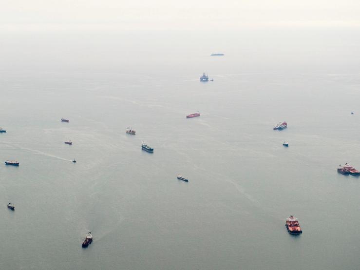 An aerial view of ships waiting to dock at a port in the Atlantic Ocean off the coast of Luanda.