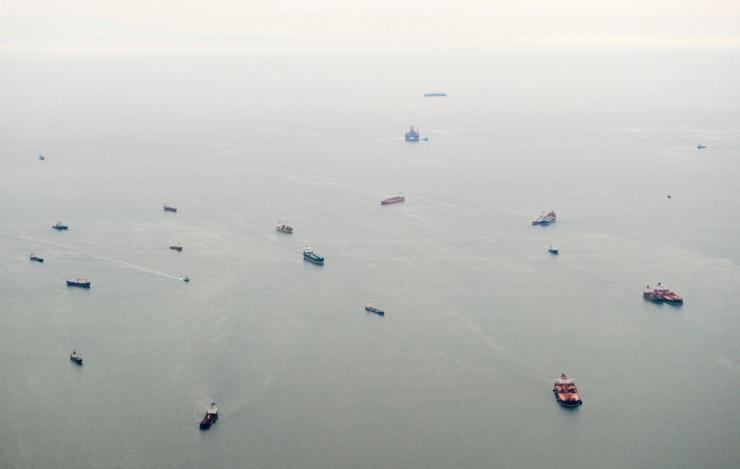 An aerial view of ships waiting to dock at a port in the Atlantic Ocean off the coast of Luanda.