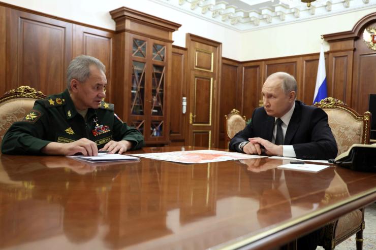 Russia’s President Vladimir Putin listens to Defence Minister Sergei Shoigu during a meeting in Moscow, Russia February 20, 2024.