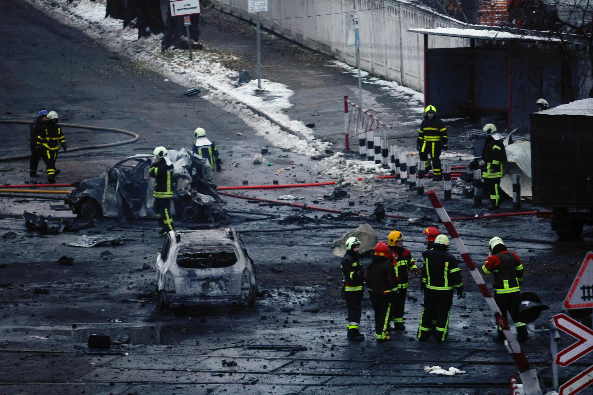 Rescuers work at a site of a Russian missile strike, amid Russia's attack on Ukraine, in Kyiv, November 23, 2022.