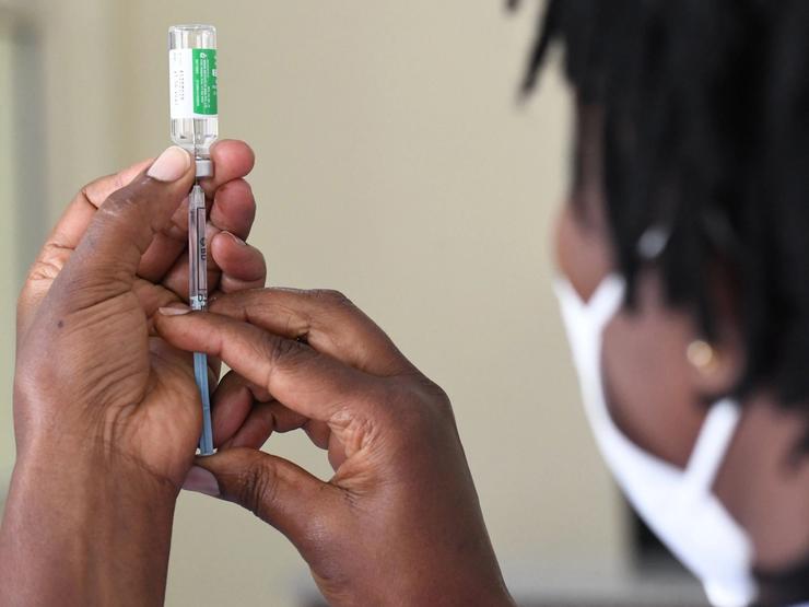 A Kenyan health worker prepares to administer a dose of the Oxford/AstraZeneca vaccine to her colleagues in Nairobi on March 05, 2021.