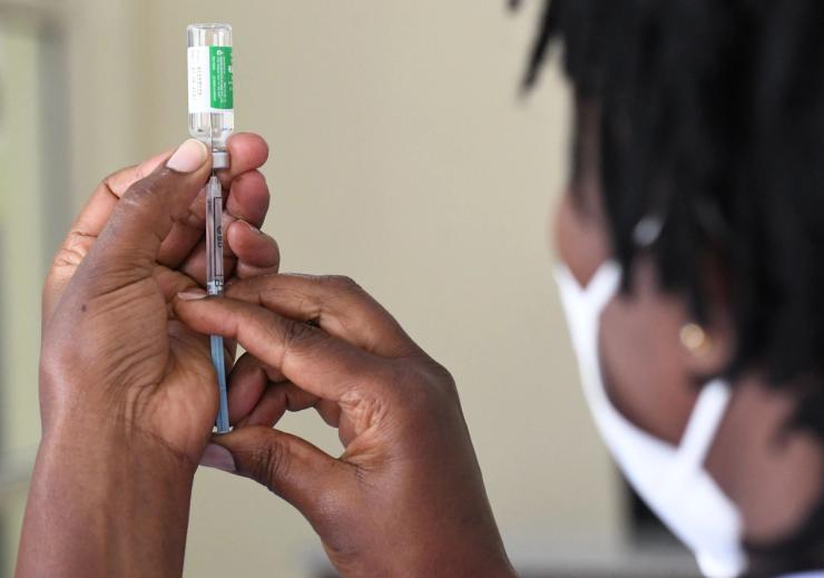 A Kenyan health worker prepares to administer a dose of the Oxford/AstraZeneca vaccine to her colleagues in Nairobi on March 05, 2021.