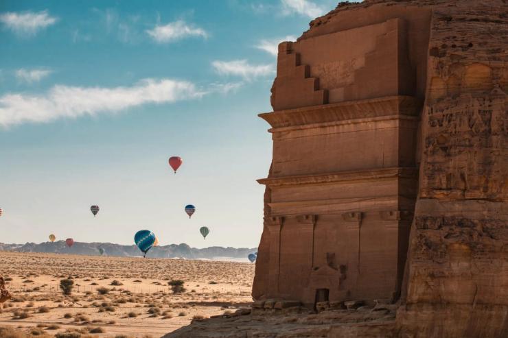 Hot air balloons over Hegra in Saudi Arabia.