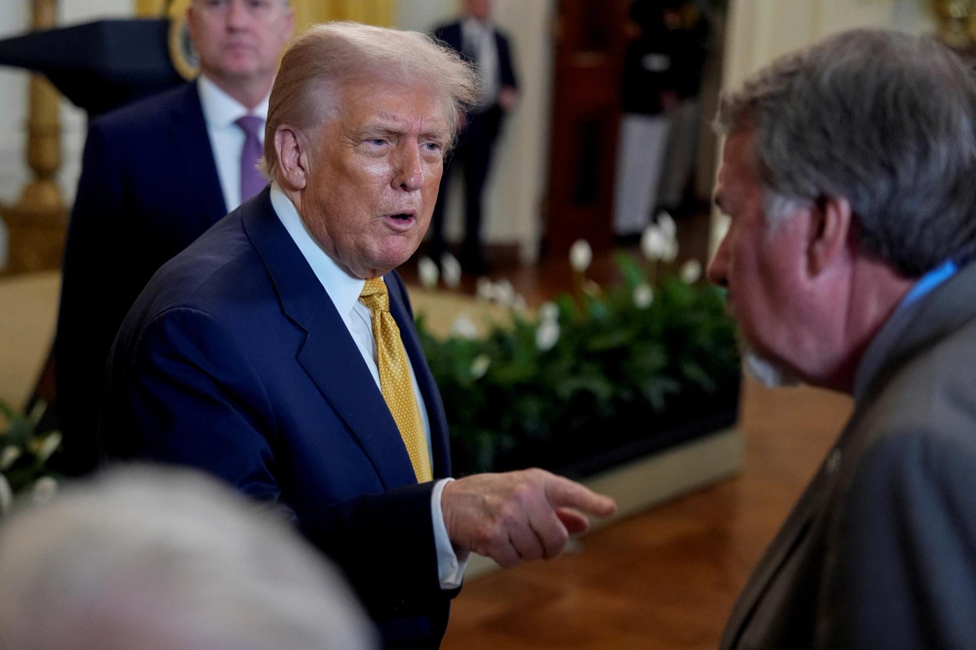 President Donald Trump greets GOP members of Congress