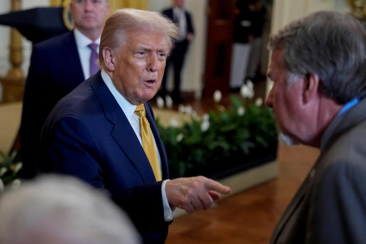 President Donald Trump greets GOP members of Congress