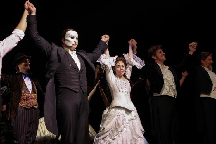 Actors on stage after a performance of Phantom of the Opera in 2021.