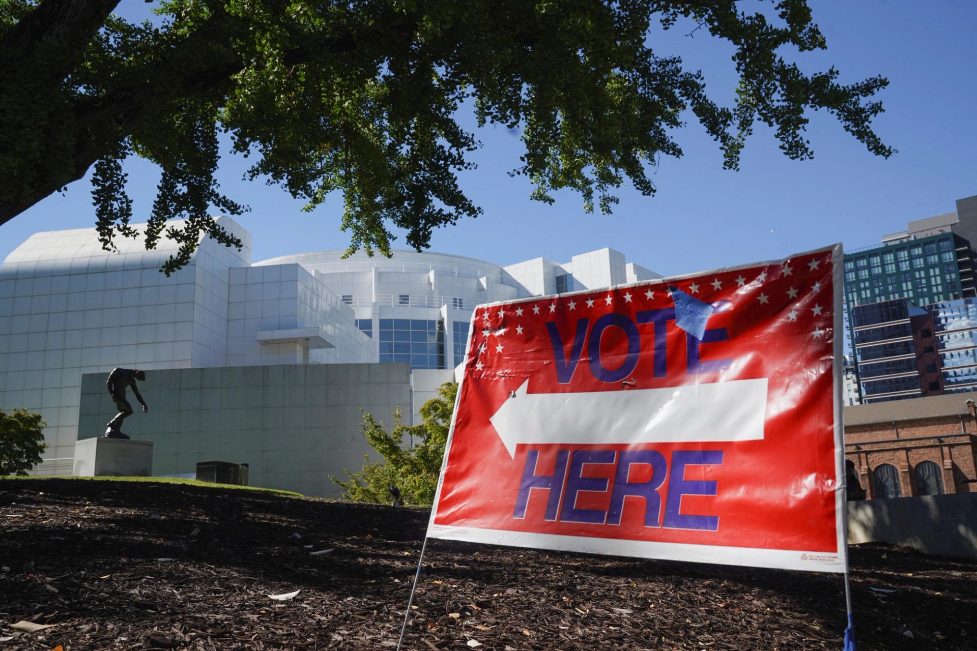 A sign sits outside of a polling station as Georgians turned out a day after the battleground state opened early voting, in Atlanta, Georgia, U.S., October 16, 2024.