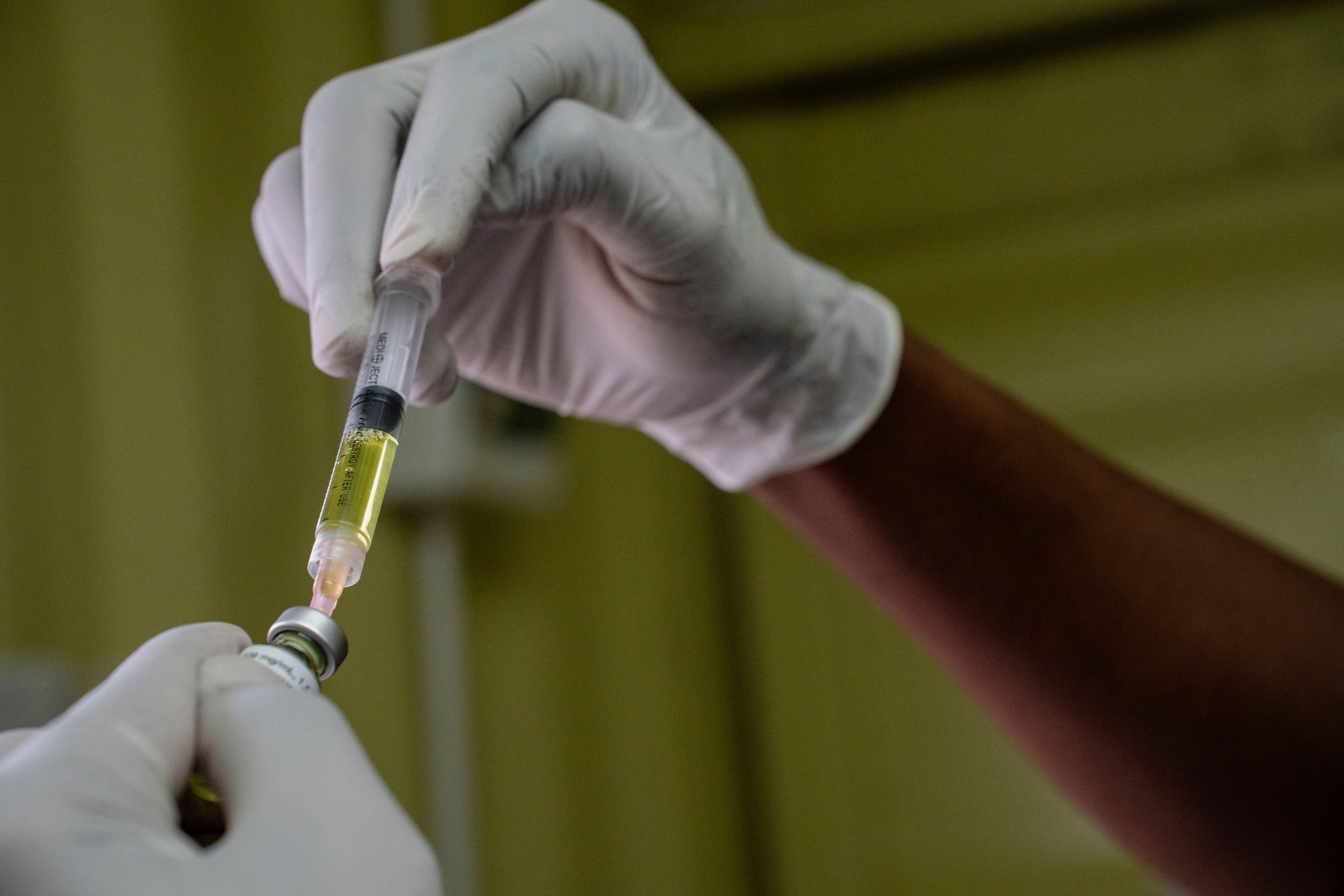 A nurse provides an HIV drug in South Africa.