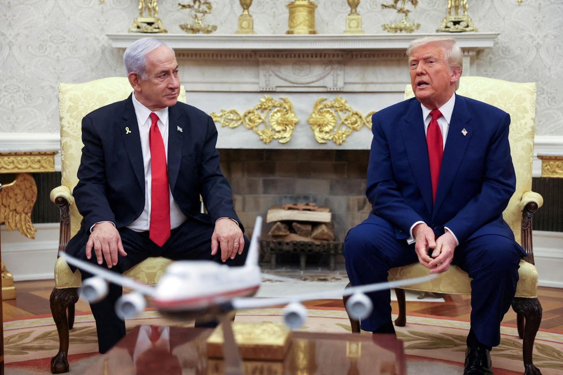 President Donald Trump talks to Israeli Prime Minister Benjamin Netanyahu during a meeting where Trump announced nuclear talks with Iran, Washington, U.S., April 7