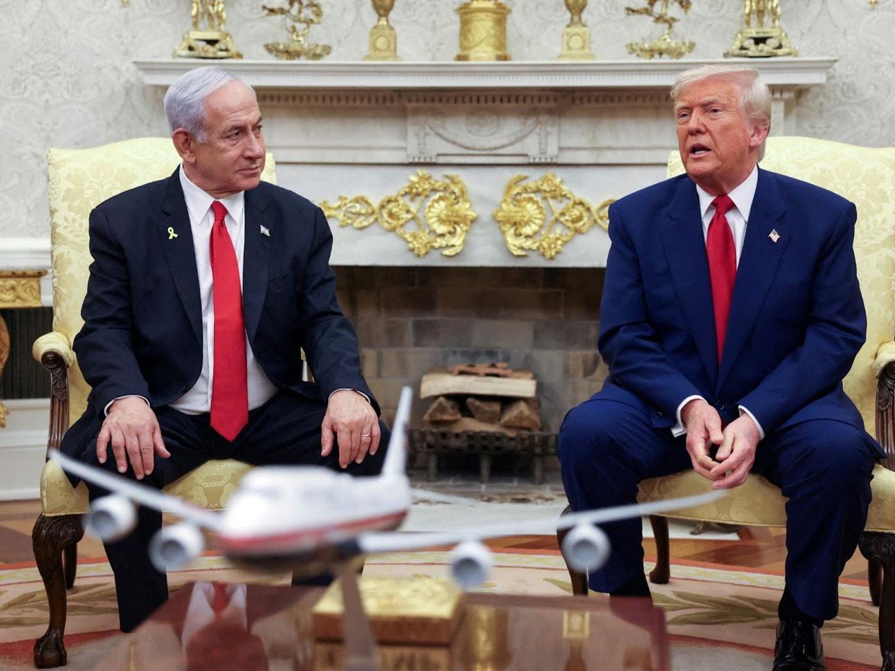 President Donald Trump talks to Israeli Prime Minister Benjamin Netanyahu during a meeting where Trump announced nuclear talks with Iran, Washington, U.S., April 7