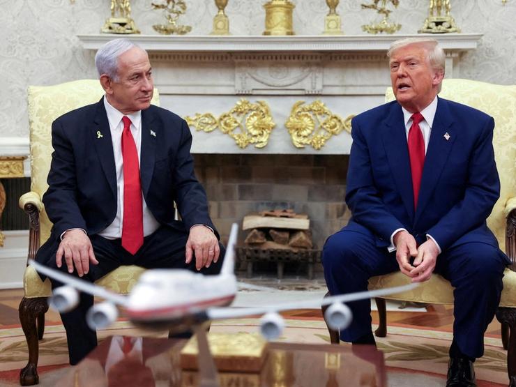 President Donald Trump talks to Israeli Prime Minister Benjamin Netanyahu during a meeting where Trump announced nuclear talks with Iran, Washington, U.S., April 7