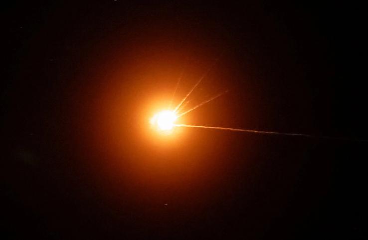 A Russian missile explodes upon being intercepted above Kyiv