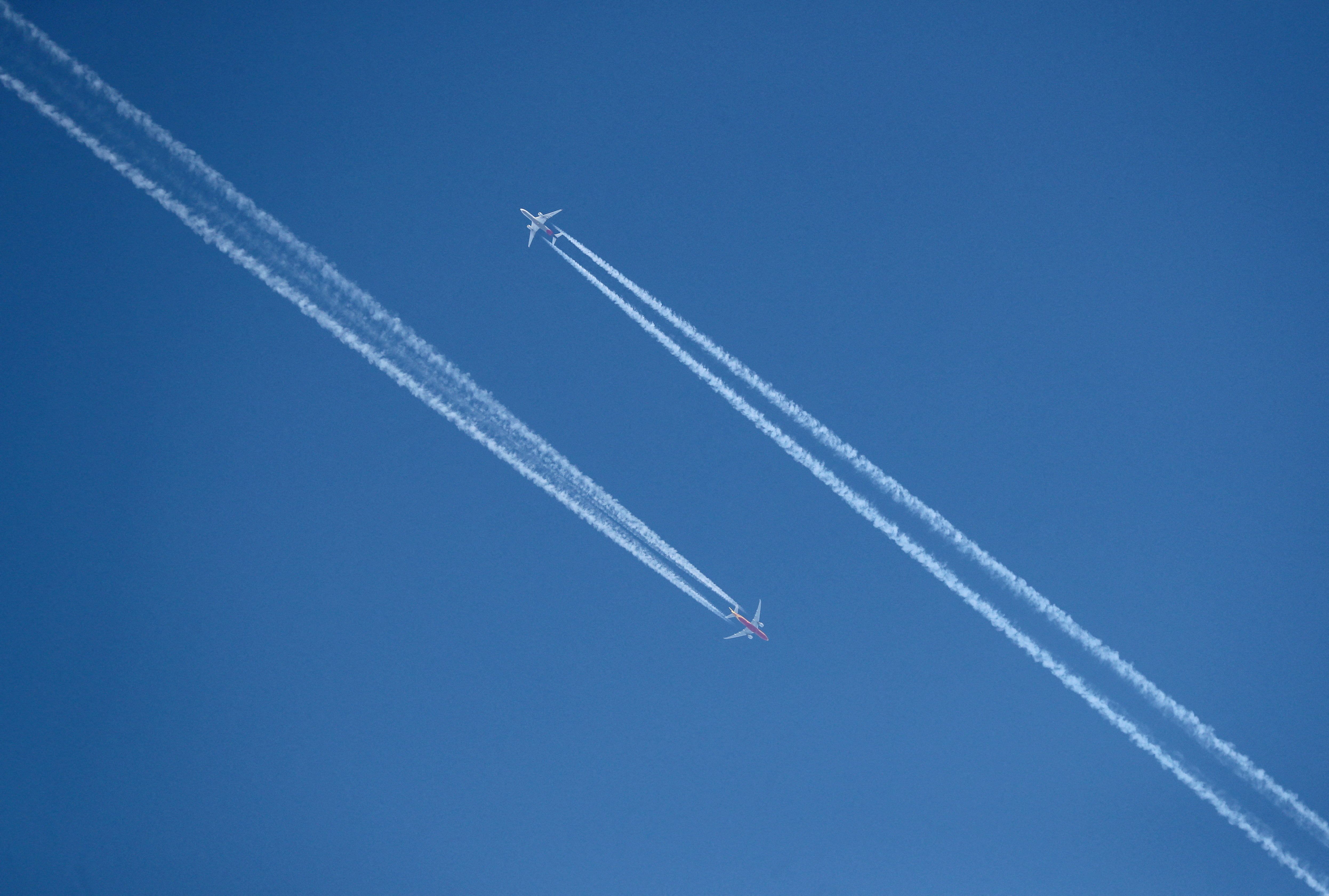 Planes leaving a vapor trail.
