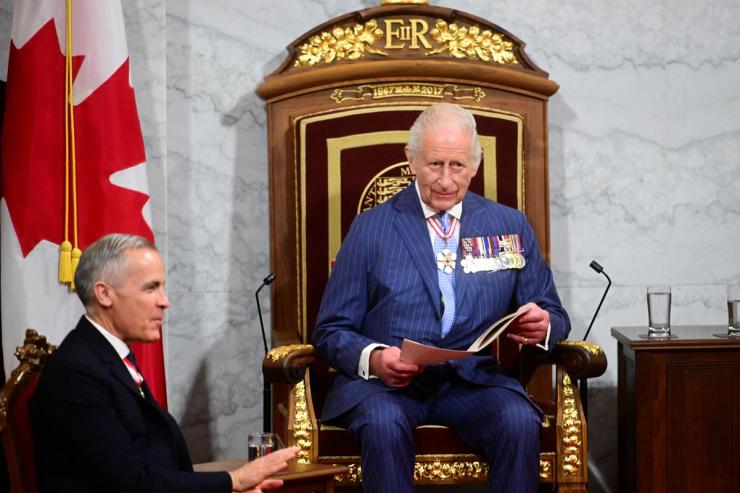 Canada’s Prime Minister Mark Carney sits near King Charles III.