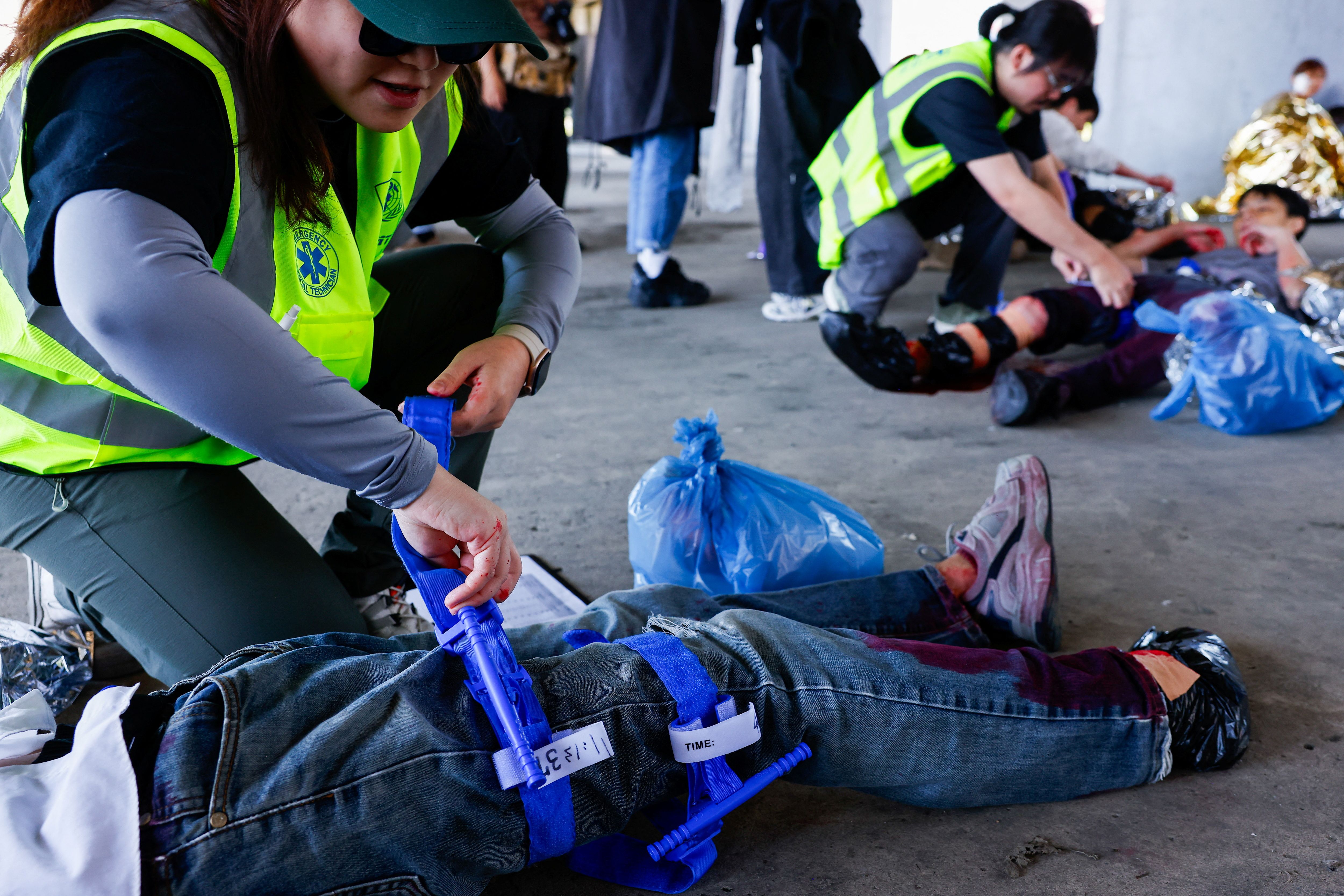 People participate in a first aid training held by Kuma Academy, a Taiwanese non-profit civil defense organization in Taipei, Taiwan, March 22, 2025.