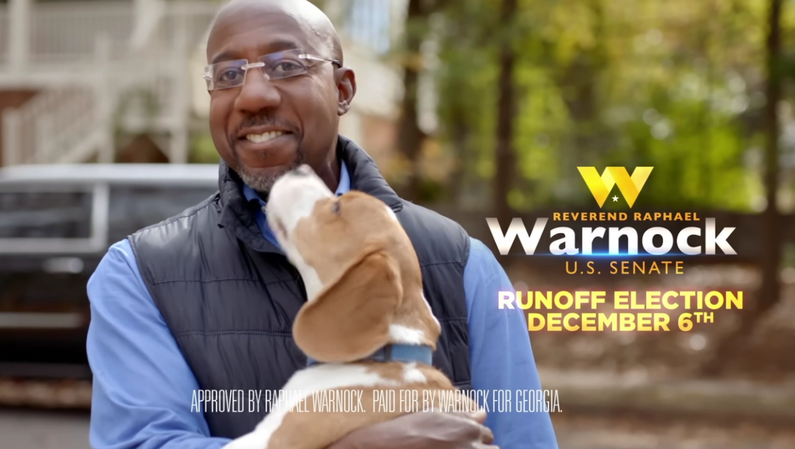 An ad for Raphael Warnock featuring a puppy. 