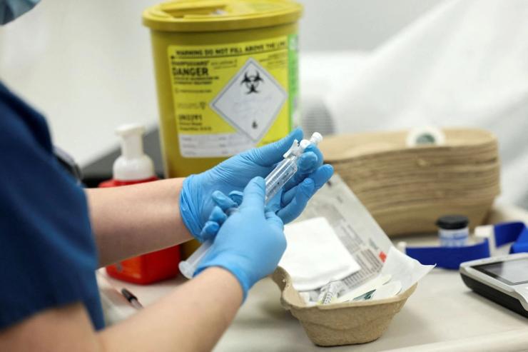 A lab worker at UCL.