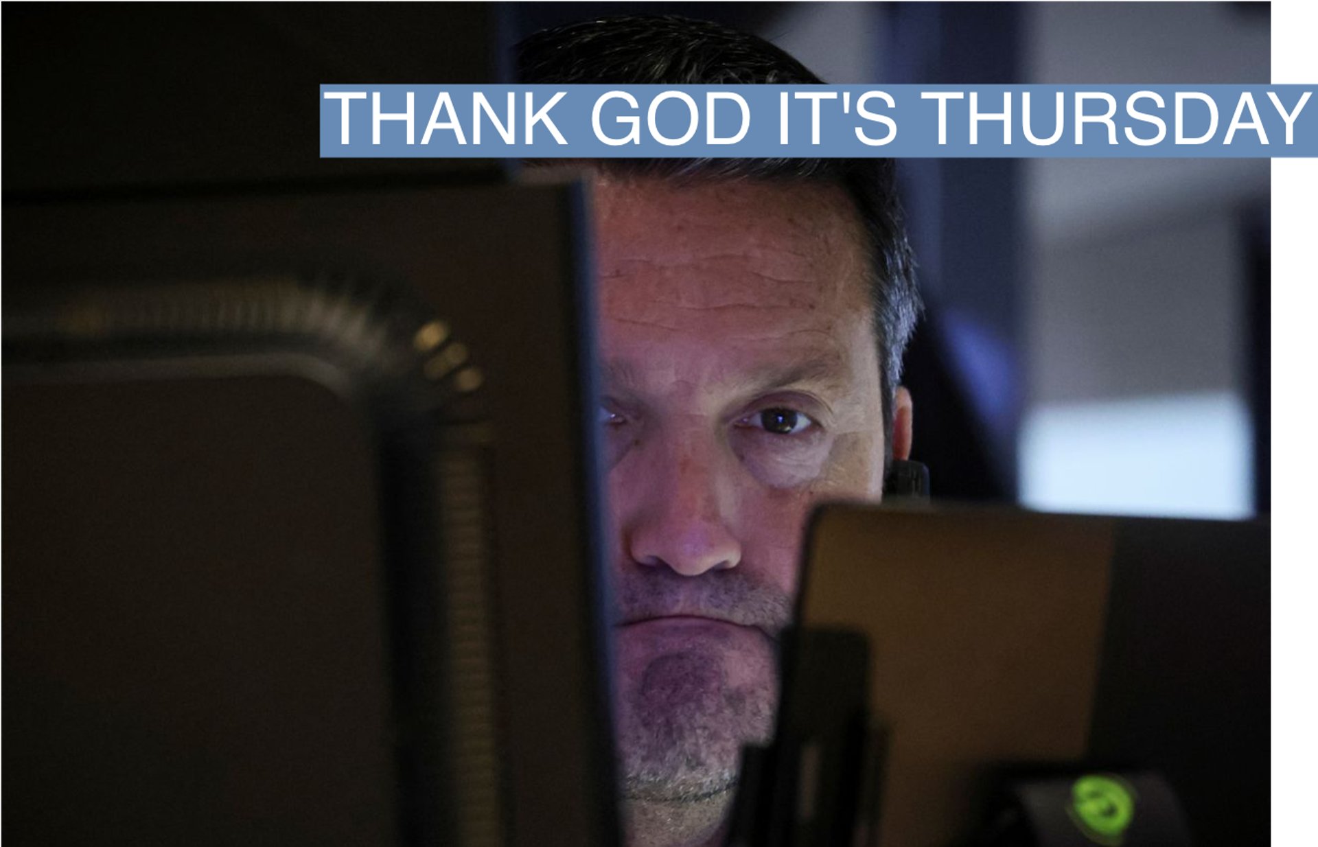 A trader works inside a post on the floor of the New York Stock Exchange (NYSE) in New York City