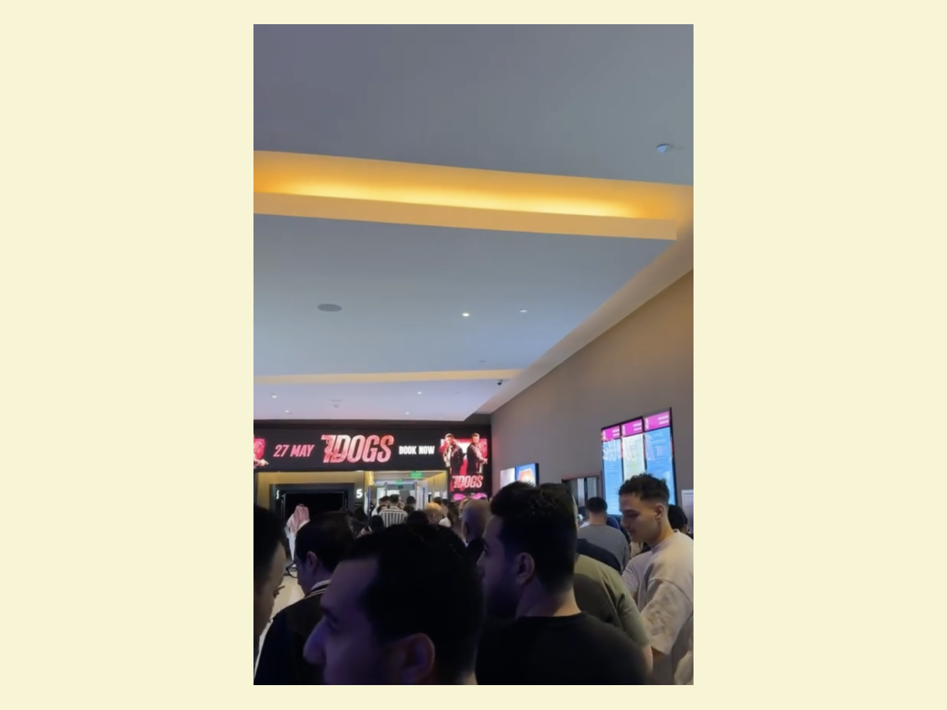 Screen grab of crowds going to see 7 dogs in theatre