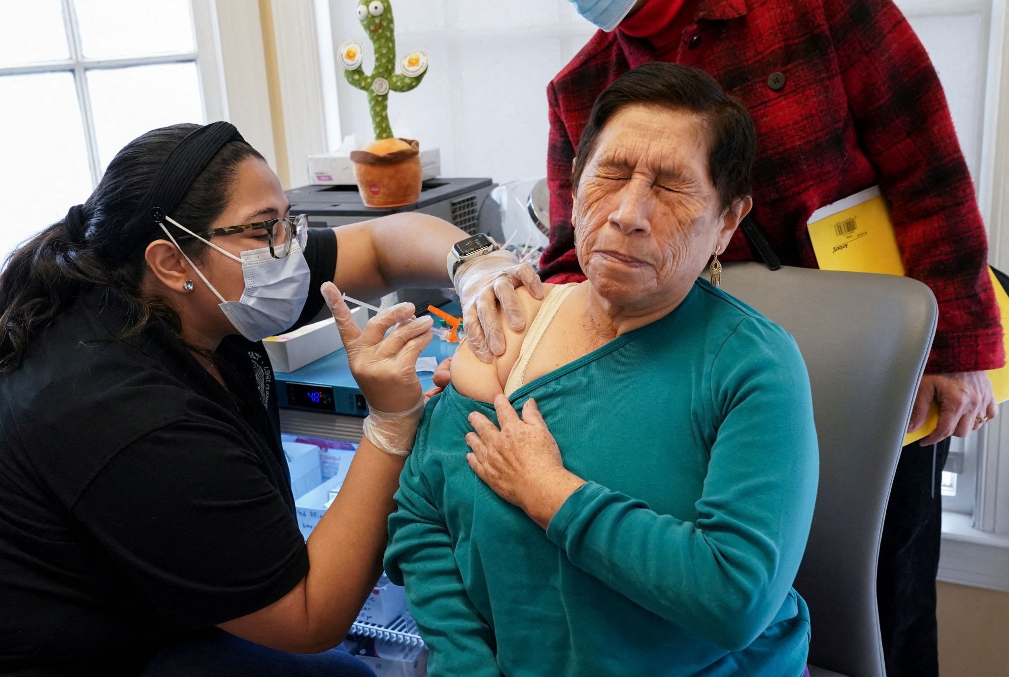 A woman gets the shingles vaccine
