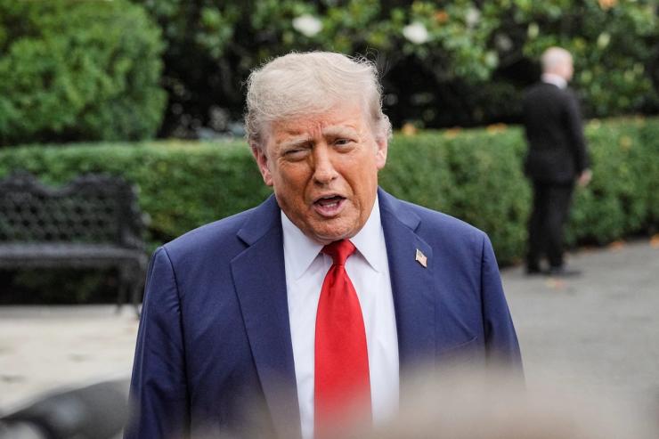 US President Donald Trump speaks to the media.