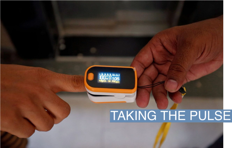 An oximeter reads a person’s pulse.