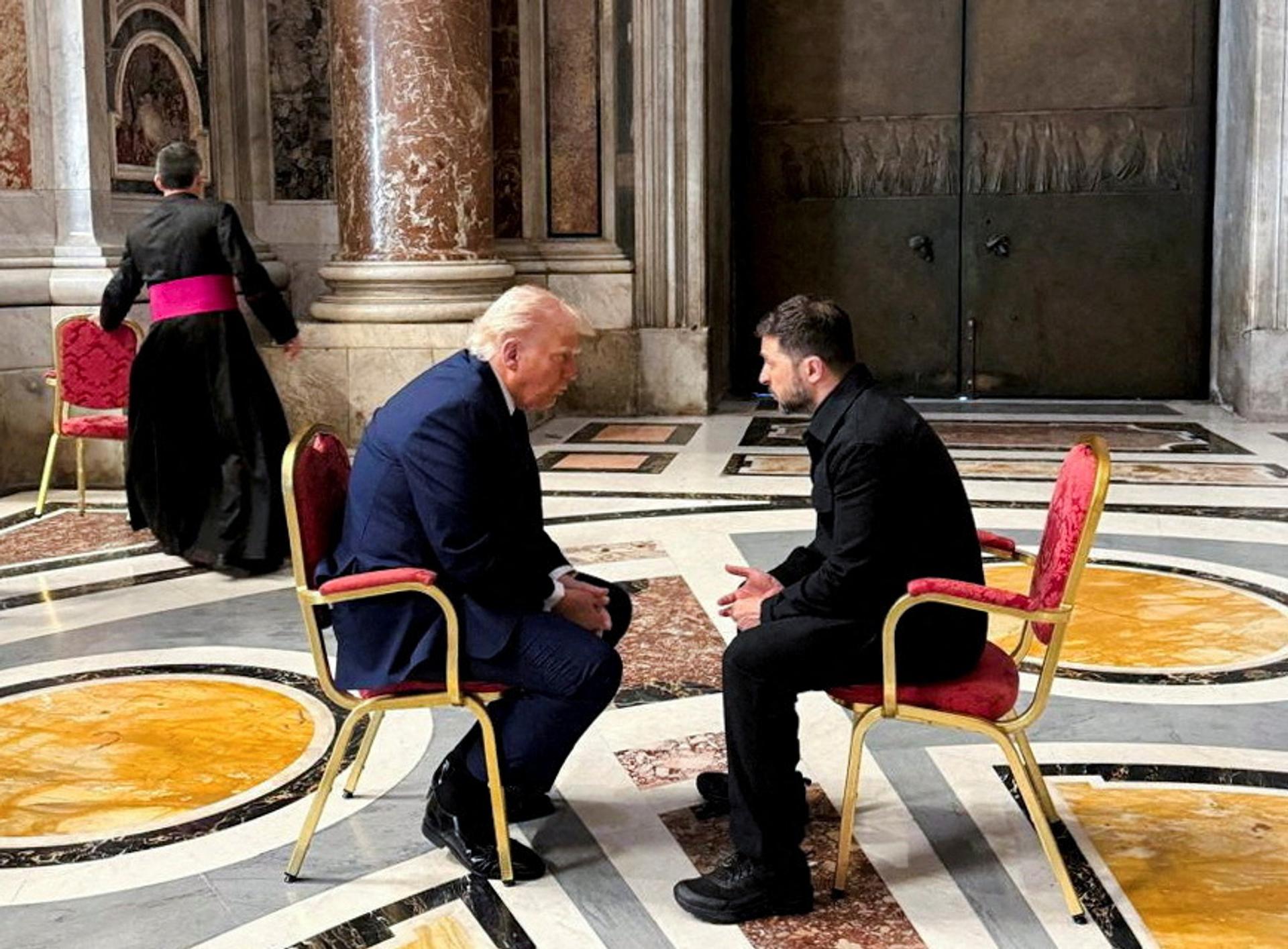U.S. President Donald Trump talks with Ukrainian President Volodymyr Zelenskyy 