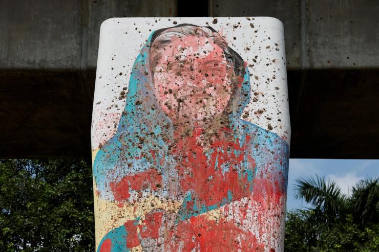 A mural of Bangladesh’s former Prime Minister Sheikh Hasina vandalised by red paint in Dhaka