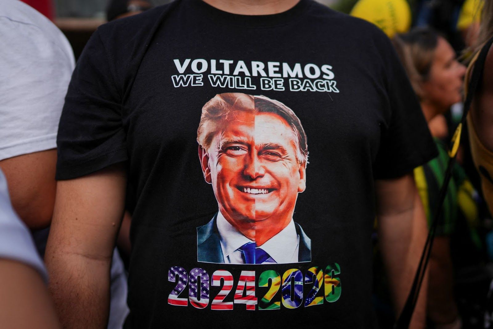 A supporter of Bolsonaro wearing a shirt with Trump and Bolsonaro’s faces