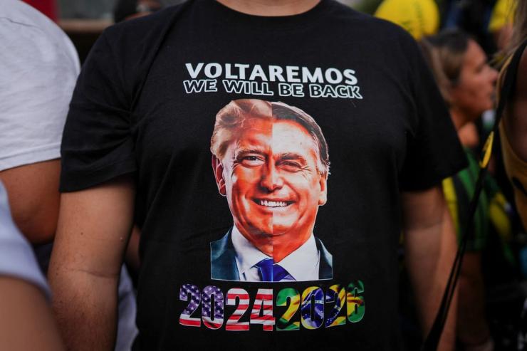 A supporter of Bolsonaro wearing a shirt with Trump and Bolsonaro’s faces