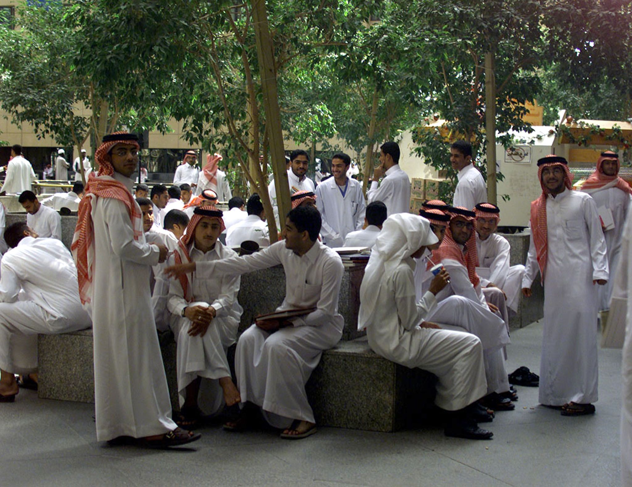Saudi students gather in numbers in a courtyard at King Saud University in Riyadh October 30, 2002.