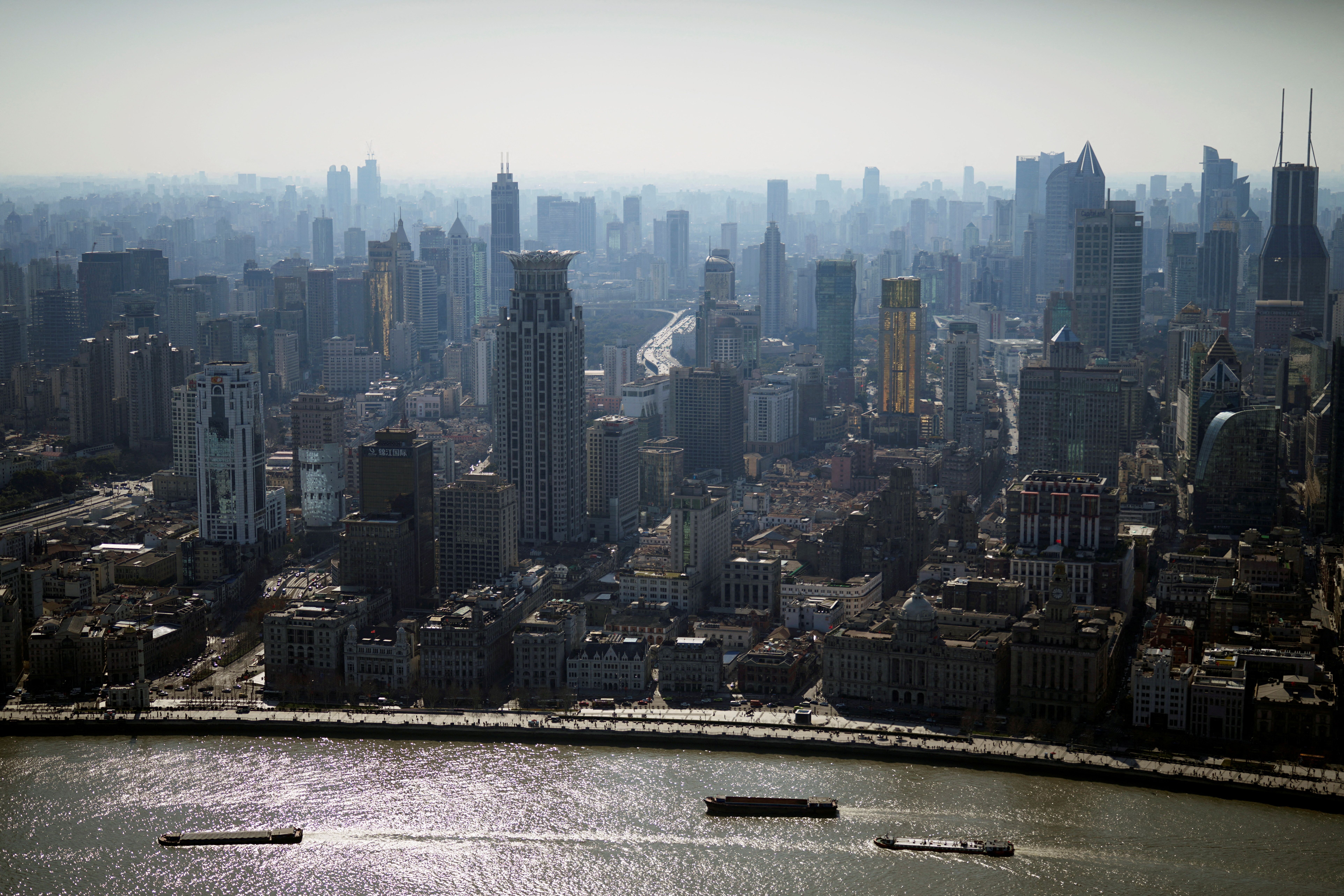 A view of the city skyline and Huangpu River in Shanghai, China, February 24, 2022.