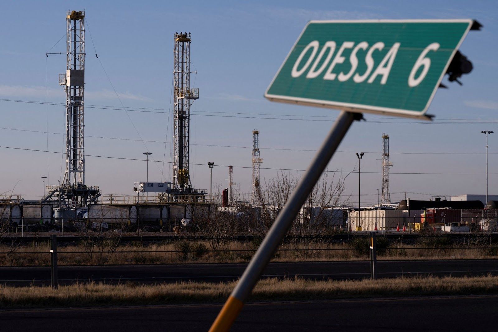 Oil rigs sit in a storage yard in the Permian Basin outside of Odessa, Texas