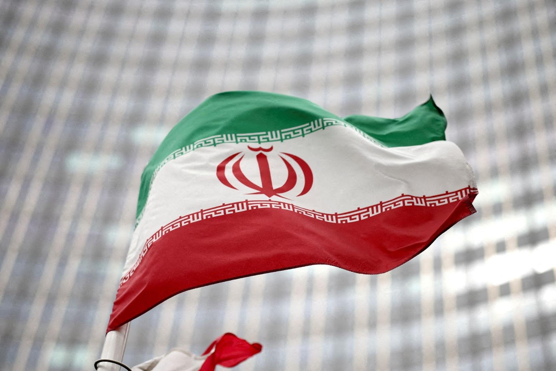 Iranian flag flies in front of the UN office building, housing IAEA headquarters, in Vienna.